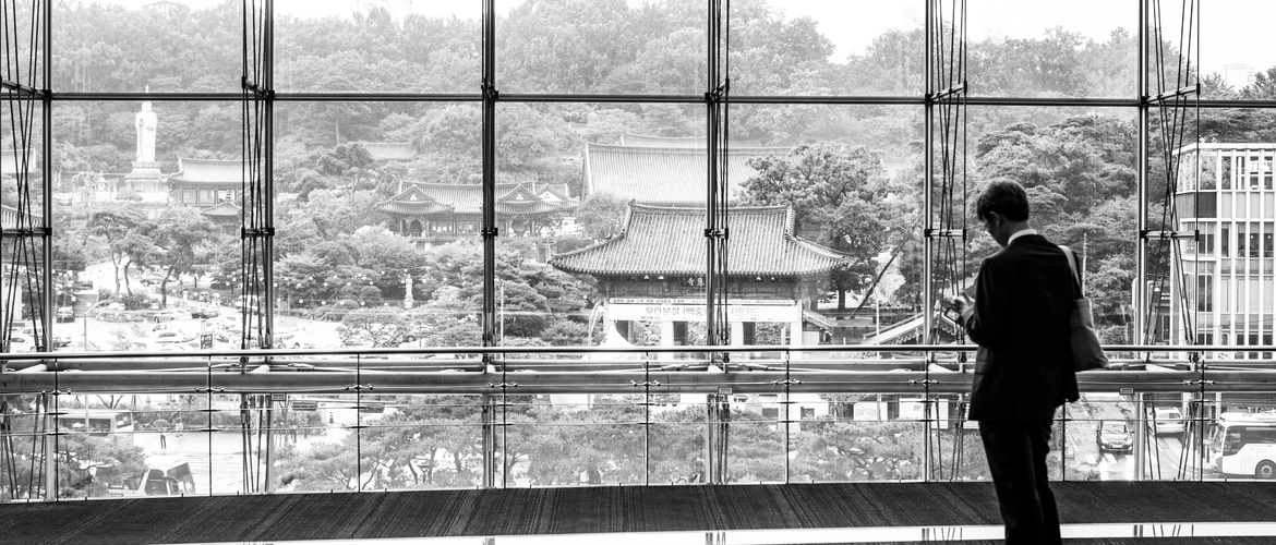 Black and white businessman in Seoul