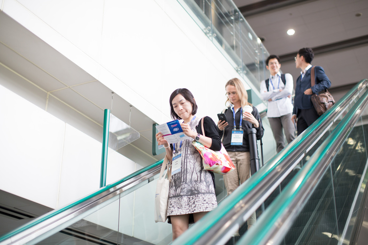 Woman studying CINP flyer